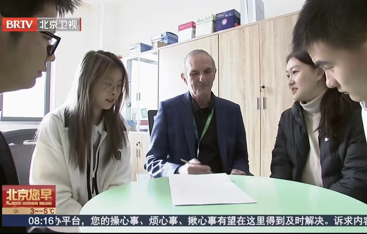 Shuhan taking part in an interview and academic discussion